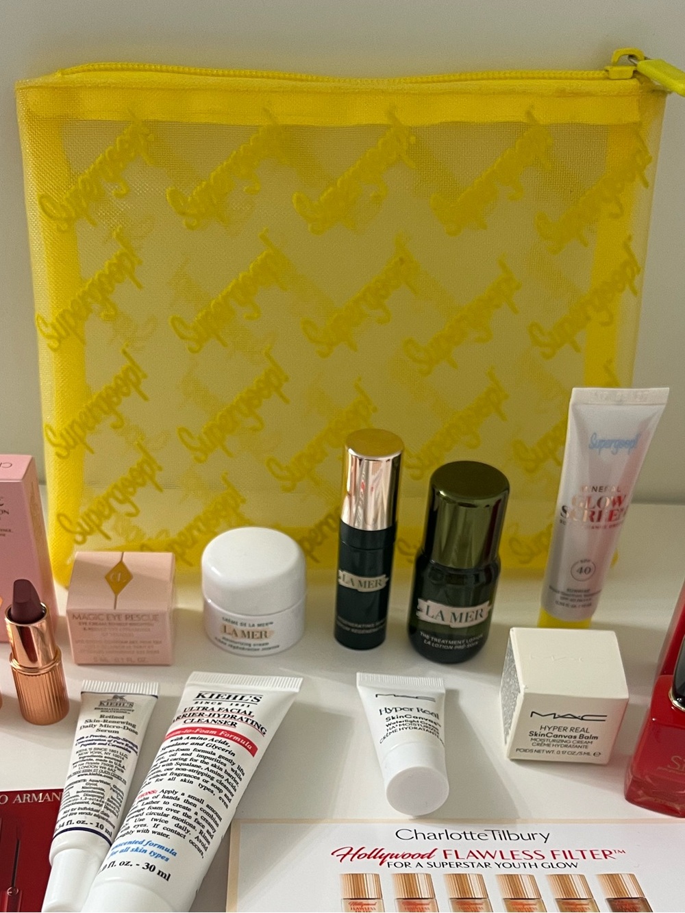Supergoop! New Yellow Mesh Travel Pouch with mini skin care fsamples bundle. - Picture 7 of 8